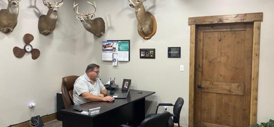 Insurance agent Jim Manes is picture in his new office in Davenport.