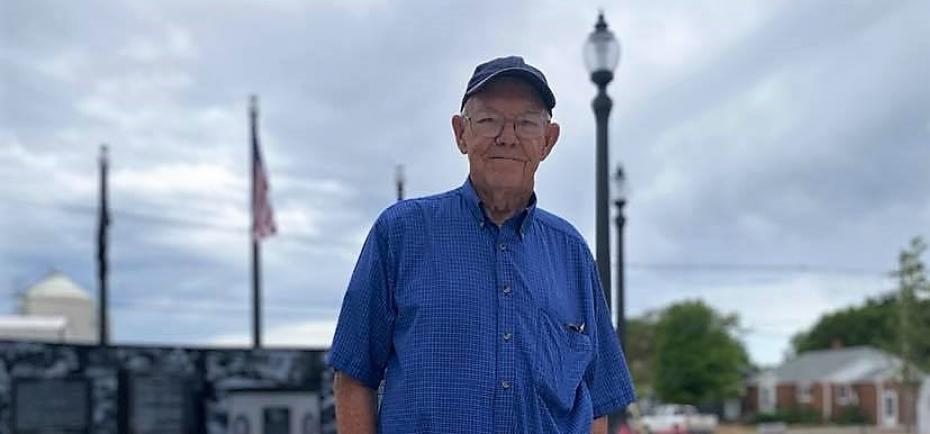 Earl Frieden, 87, stands near the new Veteran's Memorial in Shickley, NE. He is wearing a denim-blue shirt, ball cap and jeans. Frieden spent four years with the U.S. Navy (1953-1957).