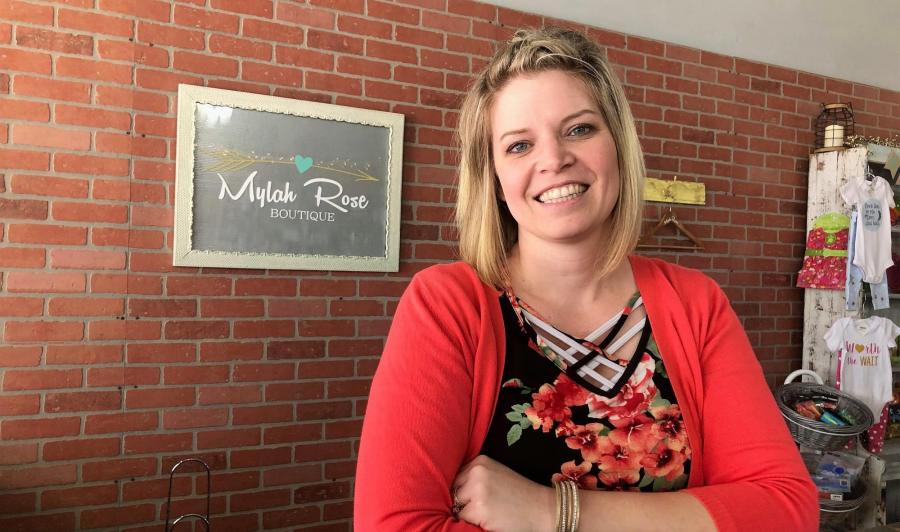Nicole Schoenholz is pictured at the counter in Mylah Rose Boutique in Geneva, NE
