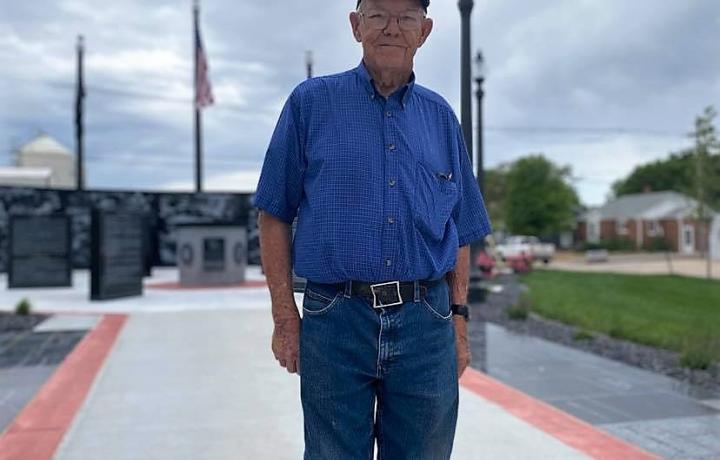 Earl Frieden, 87, stands near the new Veteran's Memorial in Shickley, NE. He is wearing a denim-blue shirt, ball cap and jeans. Frieden spent four years with the U.S. Navy (1953-1957).