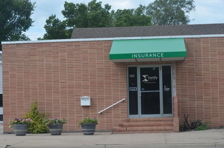 Our North Platte office is pictured. The square brick building has a bright green awning facing Jeffers St.