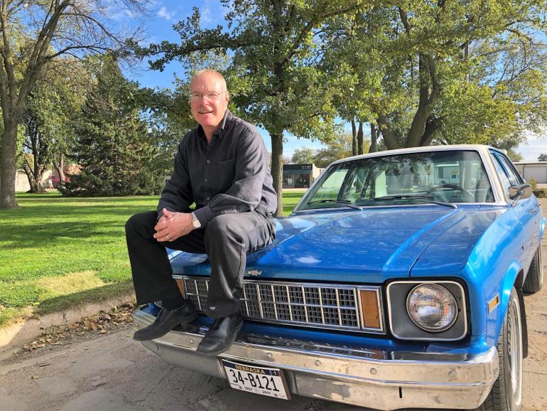 Bart Brinkman is pictured on one of his classic cars parked near the Fillmore County Courthouse. Now 62, he has successfully dealt with heart issues since birth.