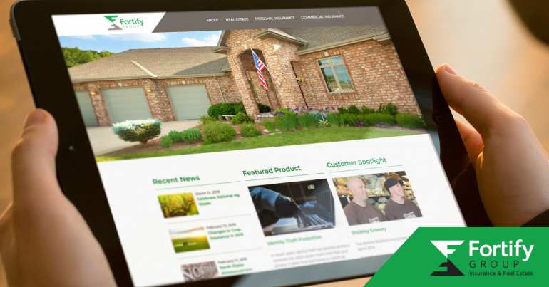 A reader uses an iPad to view a brick house on Fortify Group's new website