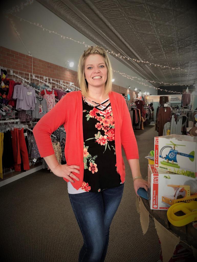 Nicole Schoenholz is pictured by a toy display inside Mylah Rose boutique in downtown Geneva, NE